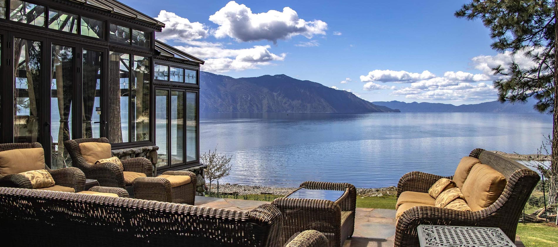 breathtakingly picturesque views of the Green Monarch Mtns. This unique custom waterfront home